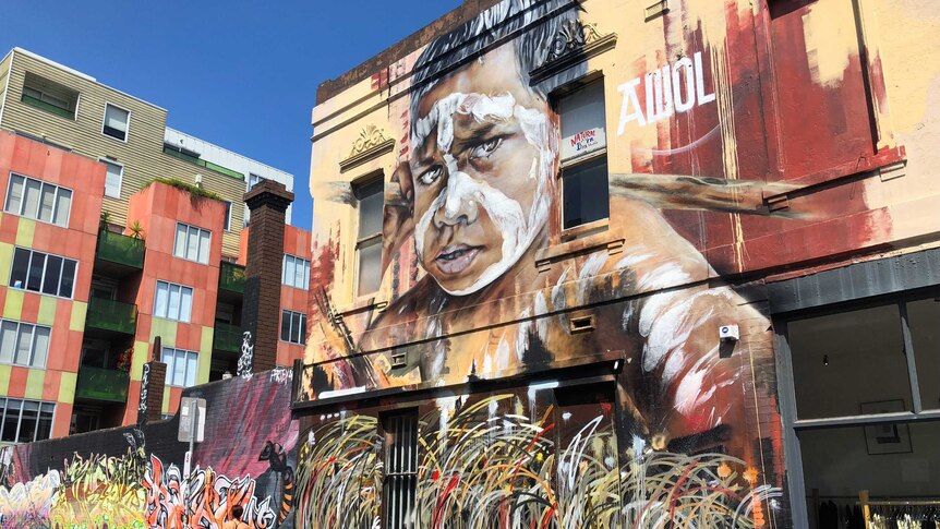 Street art on side of building in Fitzroy, Melbourne, of Indigenous boy
