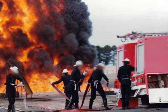 Firefighters prepare to fight flammable liquid fire at the Fiskville training facility in 1979.