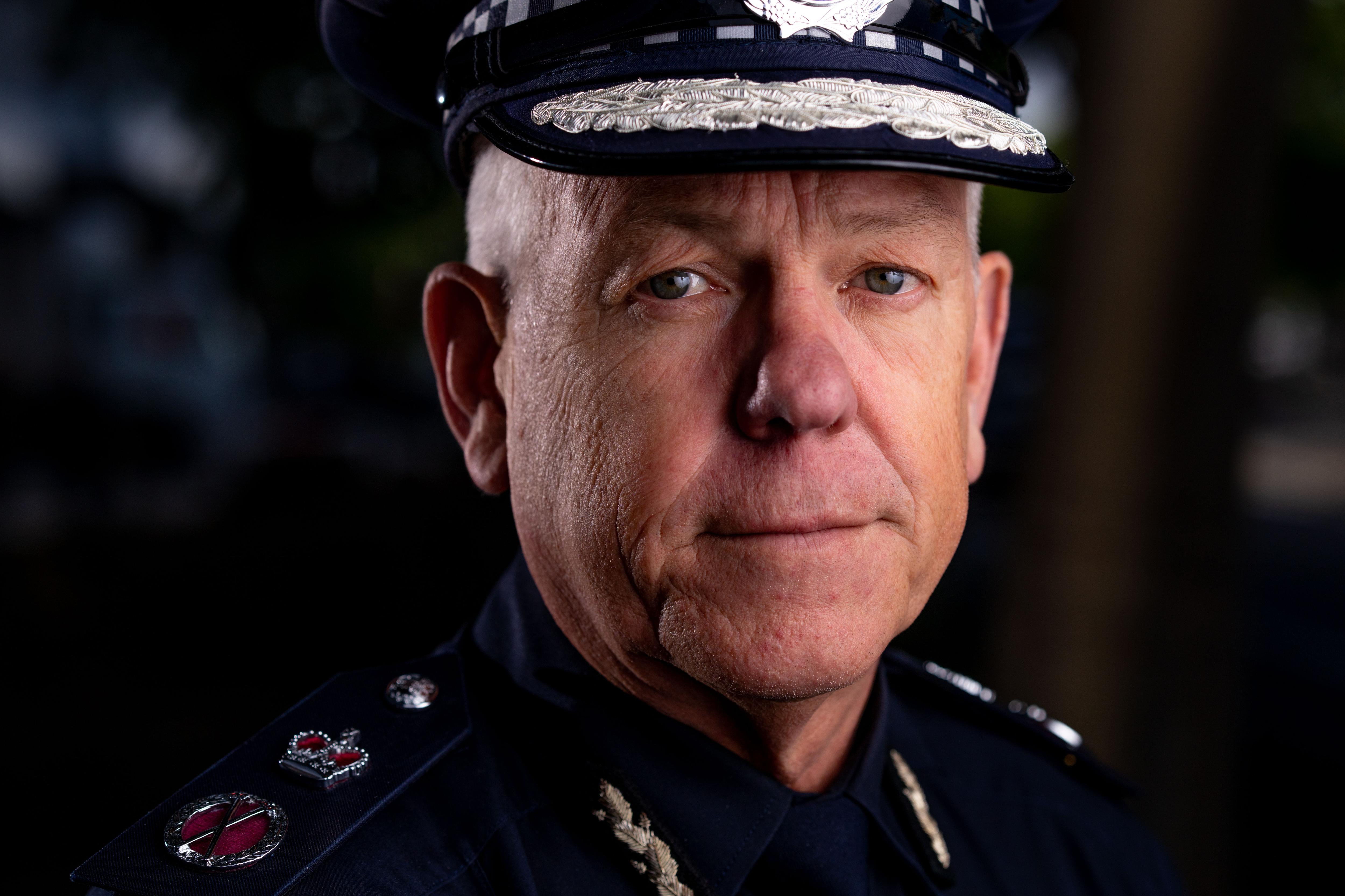 A close up of a male police officer. 