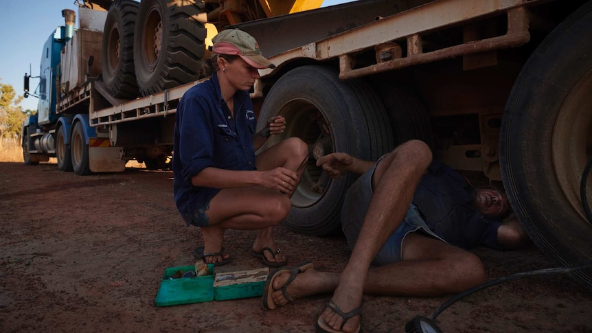 Joanna and Nick reparing a flat tyre