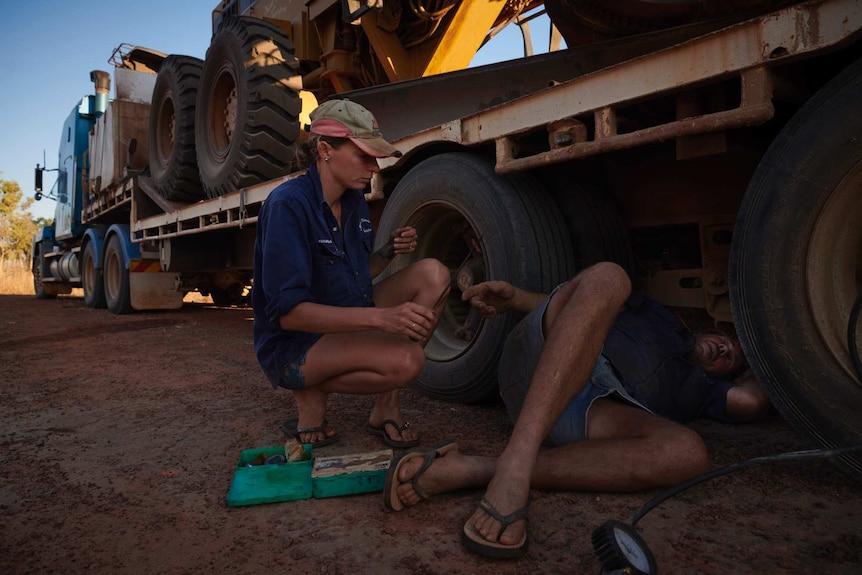 Joanna and Nick reparing a flat tyre