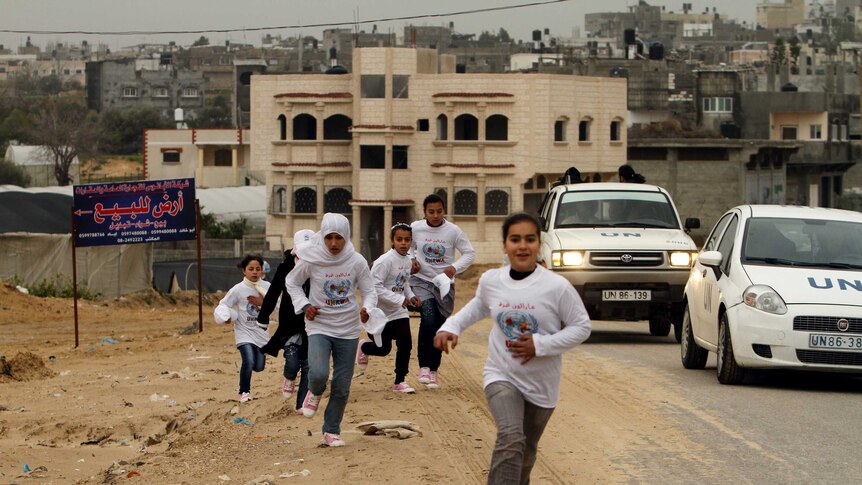 Participants compete in the UN-sponsored Gaza marathon in Gaza City.