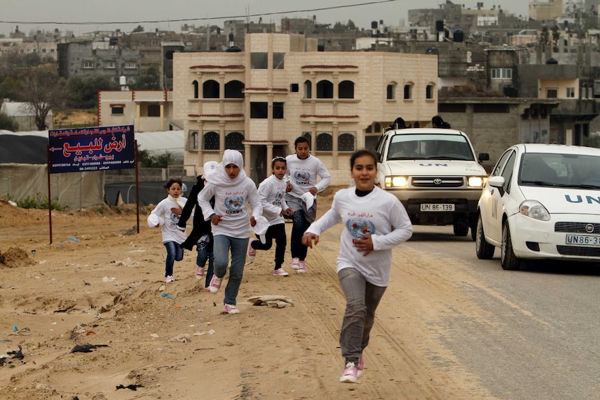 Participants compete in the UN-sponsored Gaza marathon in Gaza City.