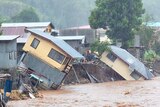 Houses sit precariously after days of heavy rain in the Solomon Islands.