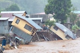 Houses sit precariously after days of heavy rain in the Solomon Islands.