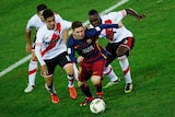 Lionel Messi takes on River Plate