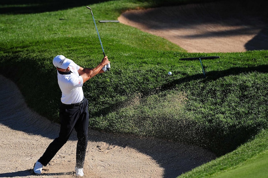 Adam Scott plays out of a bunker in the second round of the first PGA Tour play-off event