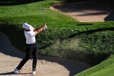 Adam Scott plays from a bunker in round two of the PGA Tour play-off on August 28, 2015.