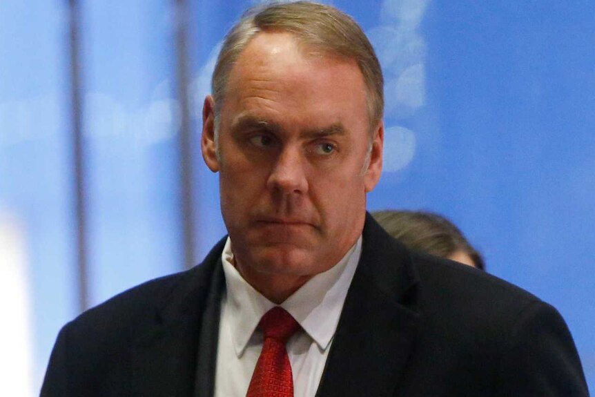 US Representative Ryan Zinke arrives for a meeting with US President-elect Donald Trump