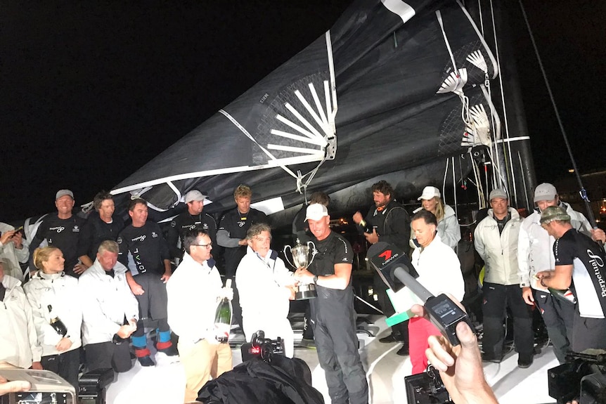 CYCA Commodore John Markos awards 2016 Sydney to Hobart line honours to Perpetual LOYAL.