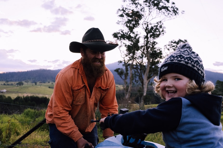 Jade Corby with his three-year-old son Mack pictured on his property in Wandella.