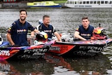 Daniel Ricciardo (L) and Max Verstappen (R) take to the Yarra River on race speedboats.