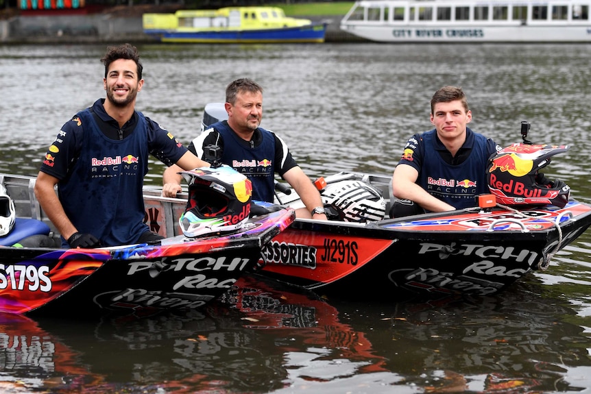 Daniel Ricciardo and Max Verstappen pose in speed boats on the Yarra River