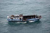 A boat carrying 46 suspected asylum seekers and two crew