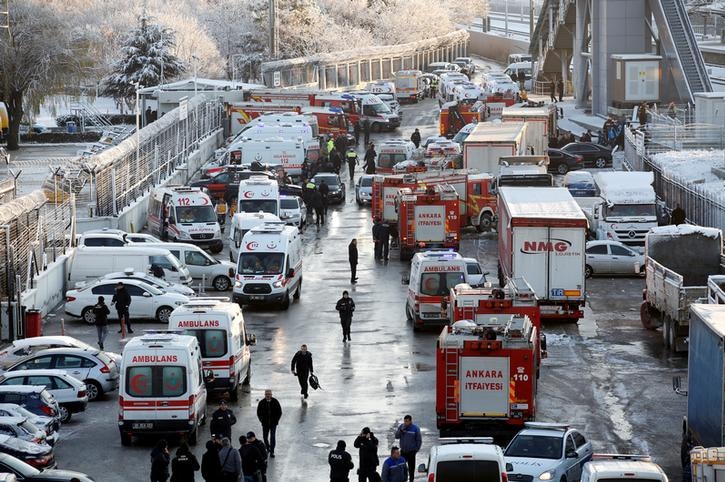 At least a dozen ambulances are seen parked near the scene of high speed crash in Turkey, with workers gathering along the road.