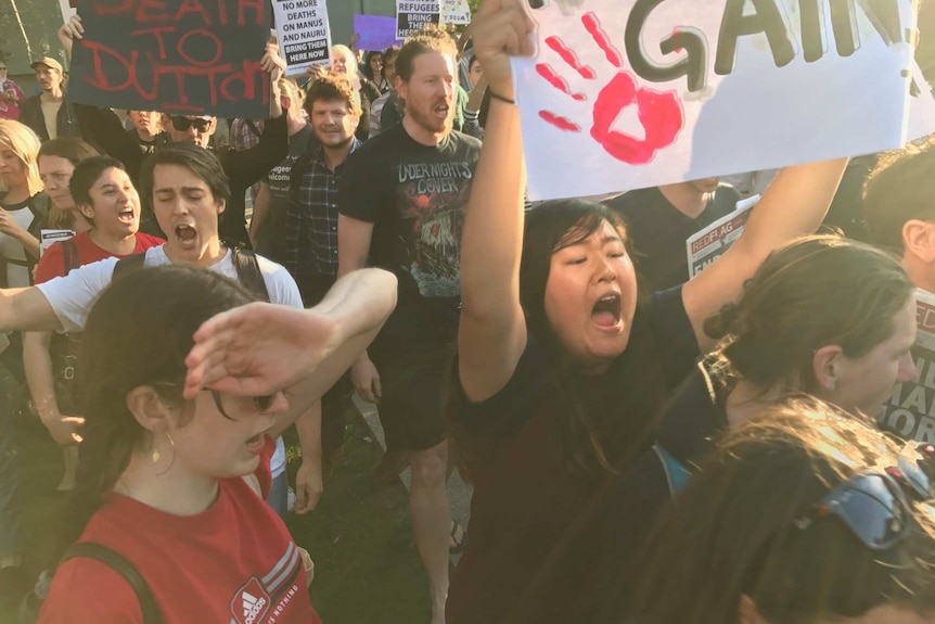 Crowd with signs.