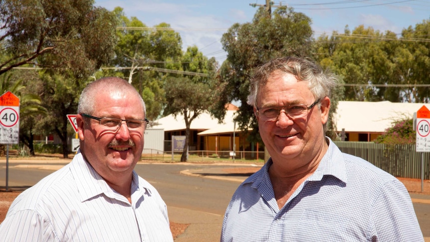 Close up shot of Leonora Shire President Peter Craig and Laverton Shire President Patrick Hill on a Leonora street.