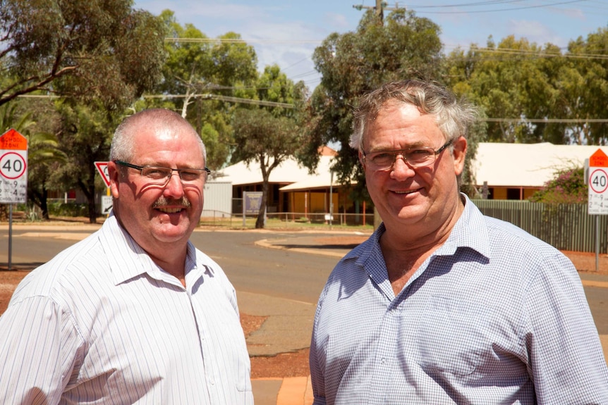 Close up shot of Leonora Shire President Peter Craig and Laverton Shire President Patrick Hill on a Leonora street.