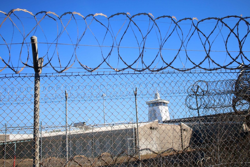 Barb wire fences stretch along the length of the Don Dale youth detention centre.