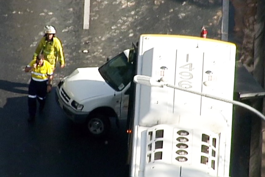 The front of a bus that collided with a ute.