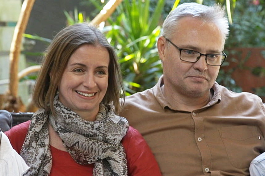 Lorinda and David Smith sit on a sofa