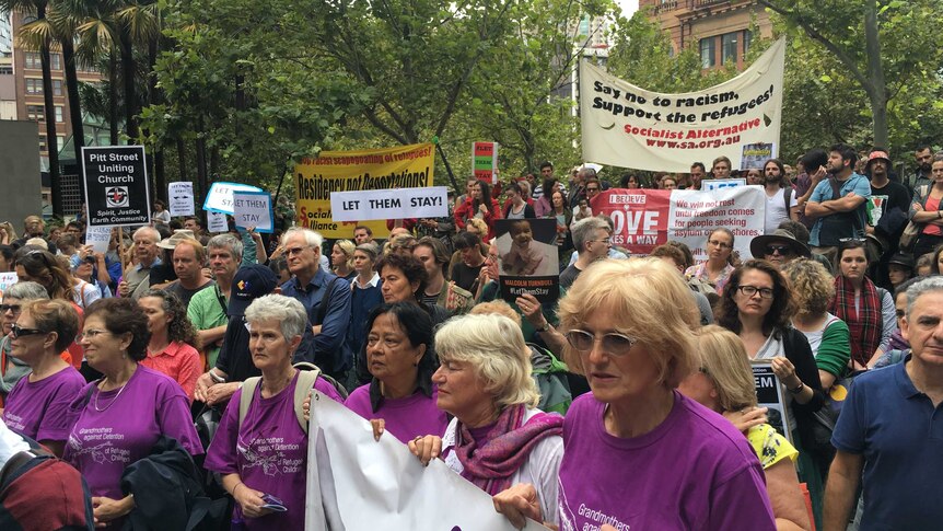 Hundreds of protesters rally outside the Department for Immigration in Sydney.