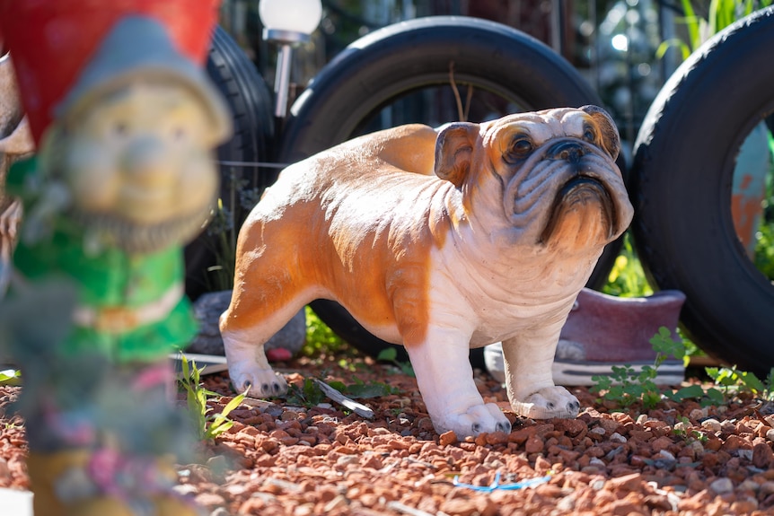 A concrete statue of a bulldog