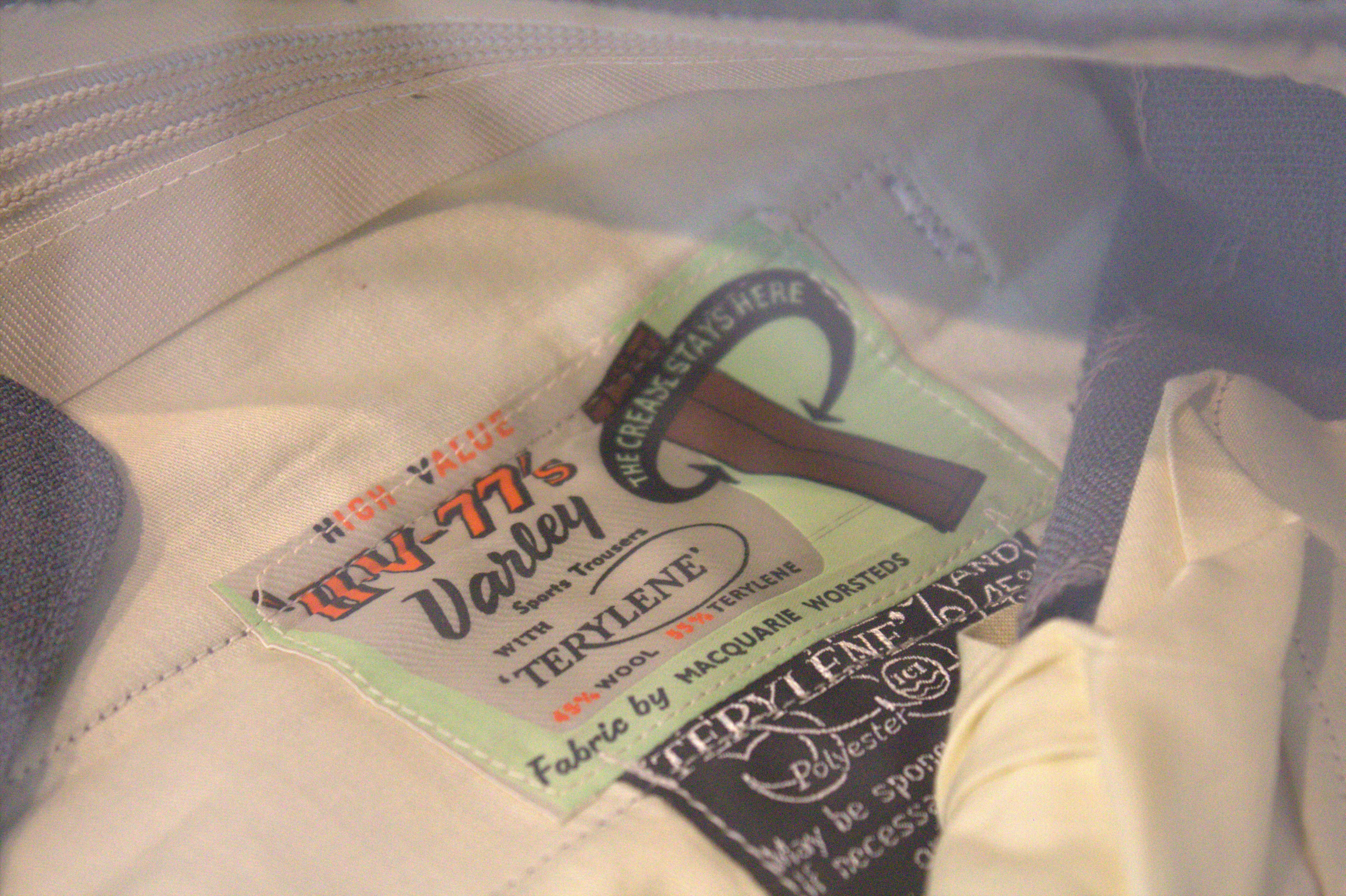 The label of a pair of pants, which reads "fabric by macquarie worsteds".