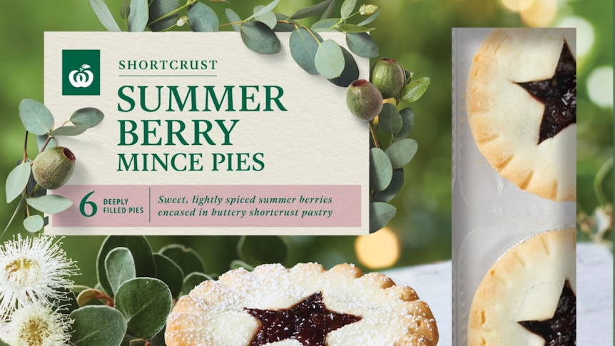 An advertisement for Woolworths mince pies that feature a star shape on the top.