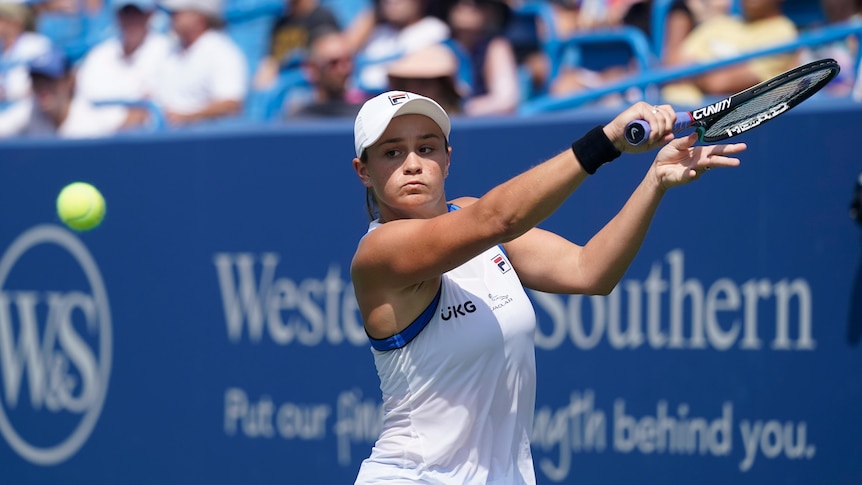 Ash Barty watches the ball and hits a backhand