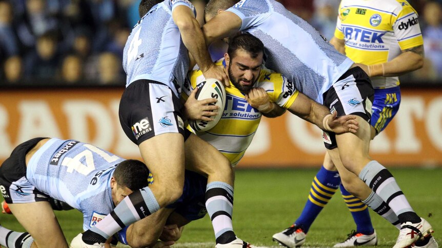 Mannah gets sandwiched against the Sharks