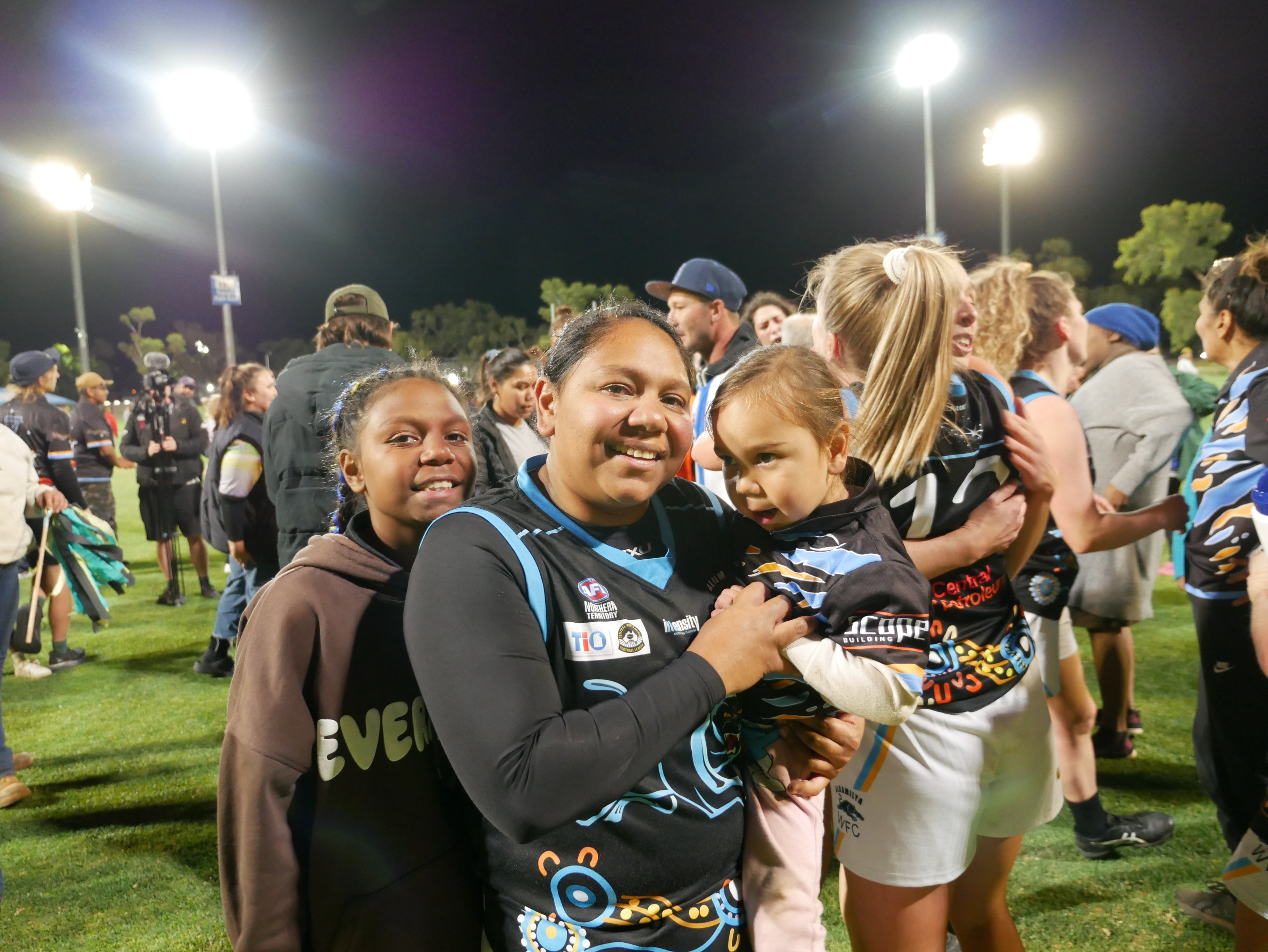 A woman and a child with a crowd around them