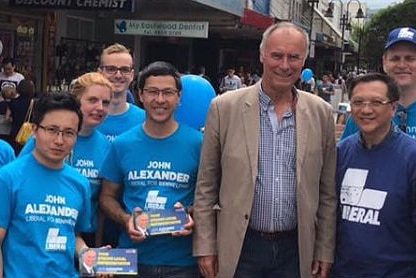 John Alexander campaigns with Mr Xu (far left).