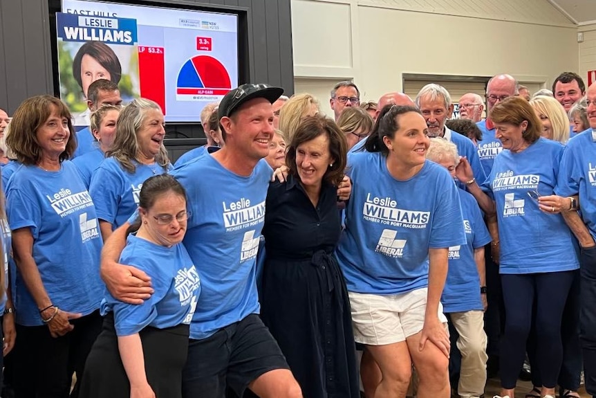 Port Macquarie MP Leslie Williams flanked by Liberal Party supporters on election night