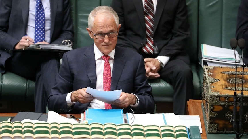 Malcolm Turnbull looks up from papers in Question Time