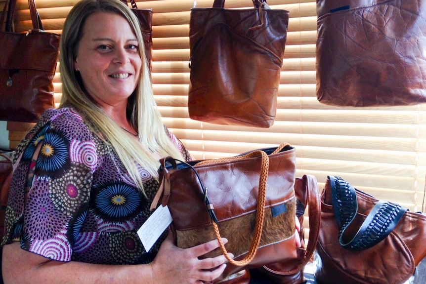 Kate Louise with her recycled handbag collection