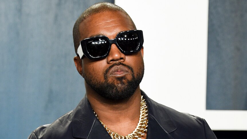 Ye with sunglasses on and a black top