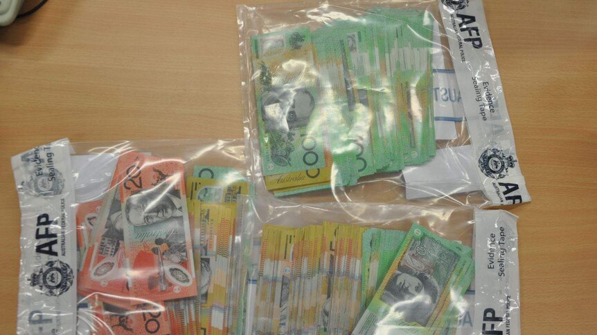 cash money in AFP bags