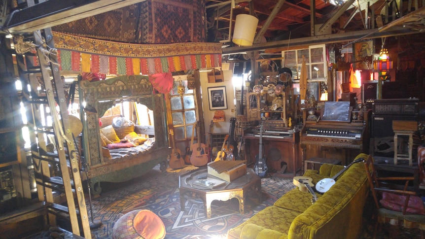 Old pianos, rugs, masks and guitars cover the walls of the Ghost Ship's interior.