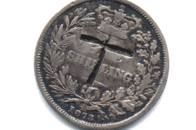 The coin with the letter T engraved on it.