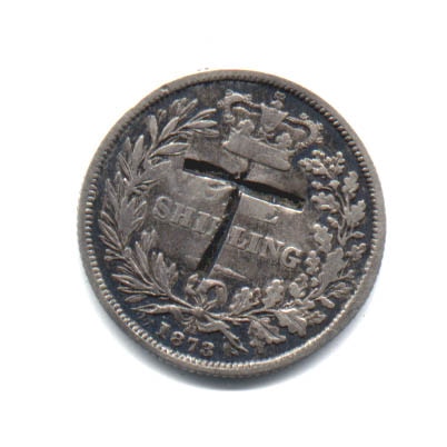 The coin with the letter T engraved on it.