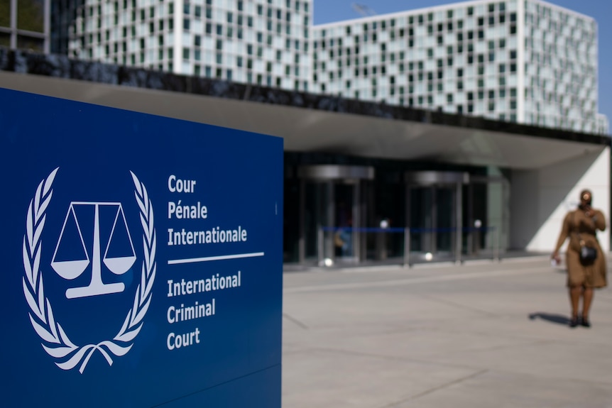 Sign of International Criminal Court showing a set of scales inside a wreath.
