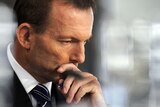 Opposition leader Tony Abbott listens during a debate