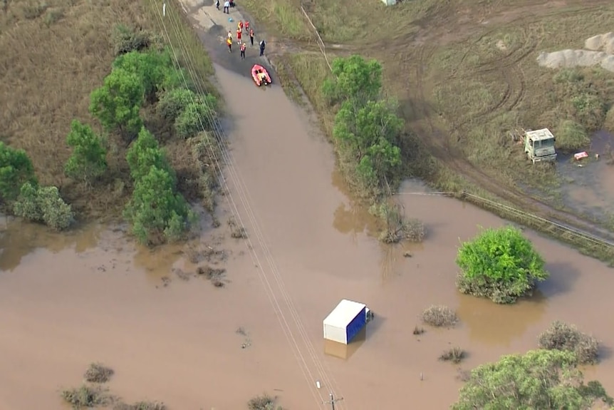 A truck submerged in floodwater