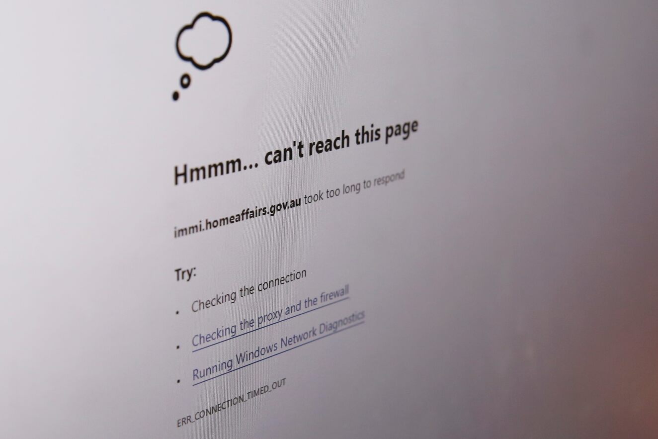 A photograph of a computer screen displaying a broken web link.