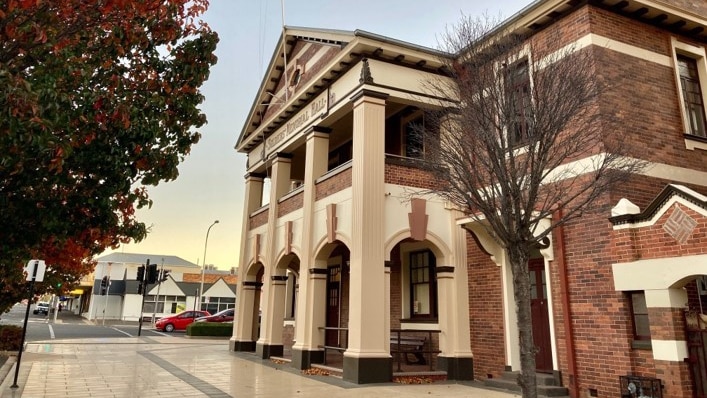 Exterior of a heritage-listed building on the main street of a town.