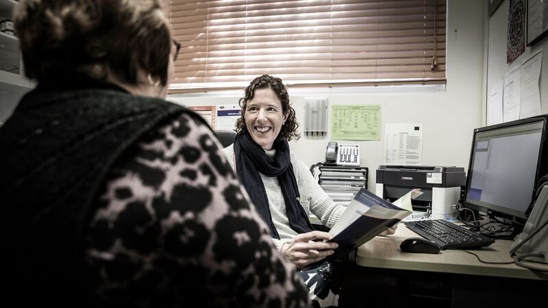 Dr Fiona Williams talk to a patient in her consulting room.