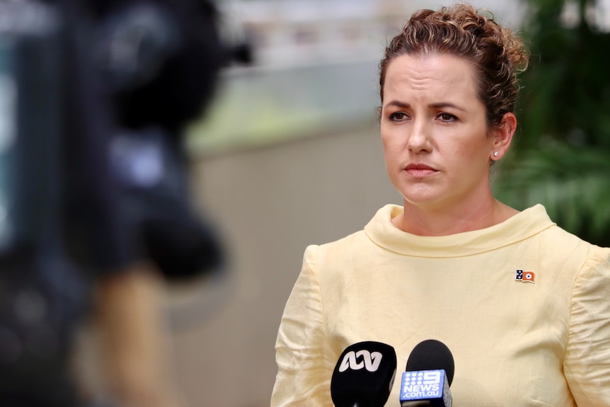 CLP leader Lia Finocchiaro standing and facing cameras and looking serious, outside NT Parliament House.