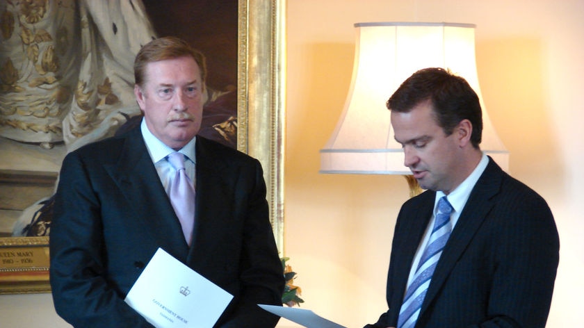 Tasmanian Premier Paul Lennon (L) with new Deputy Premier, David Bartlett being sworn in.