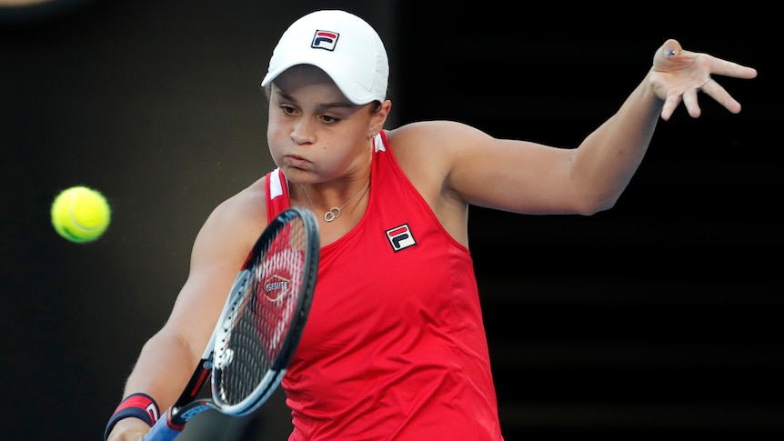 Ashleigh Barty plays a backhand return against Camila Giorgi in their second-round match at the Australian Open.